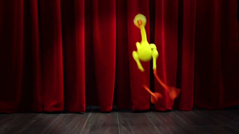 File:Rubber chicken in front of curtain.jpg